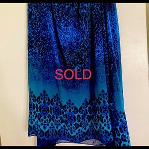 Cute silk skirt bright in color..